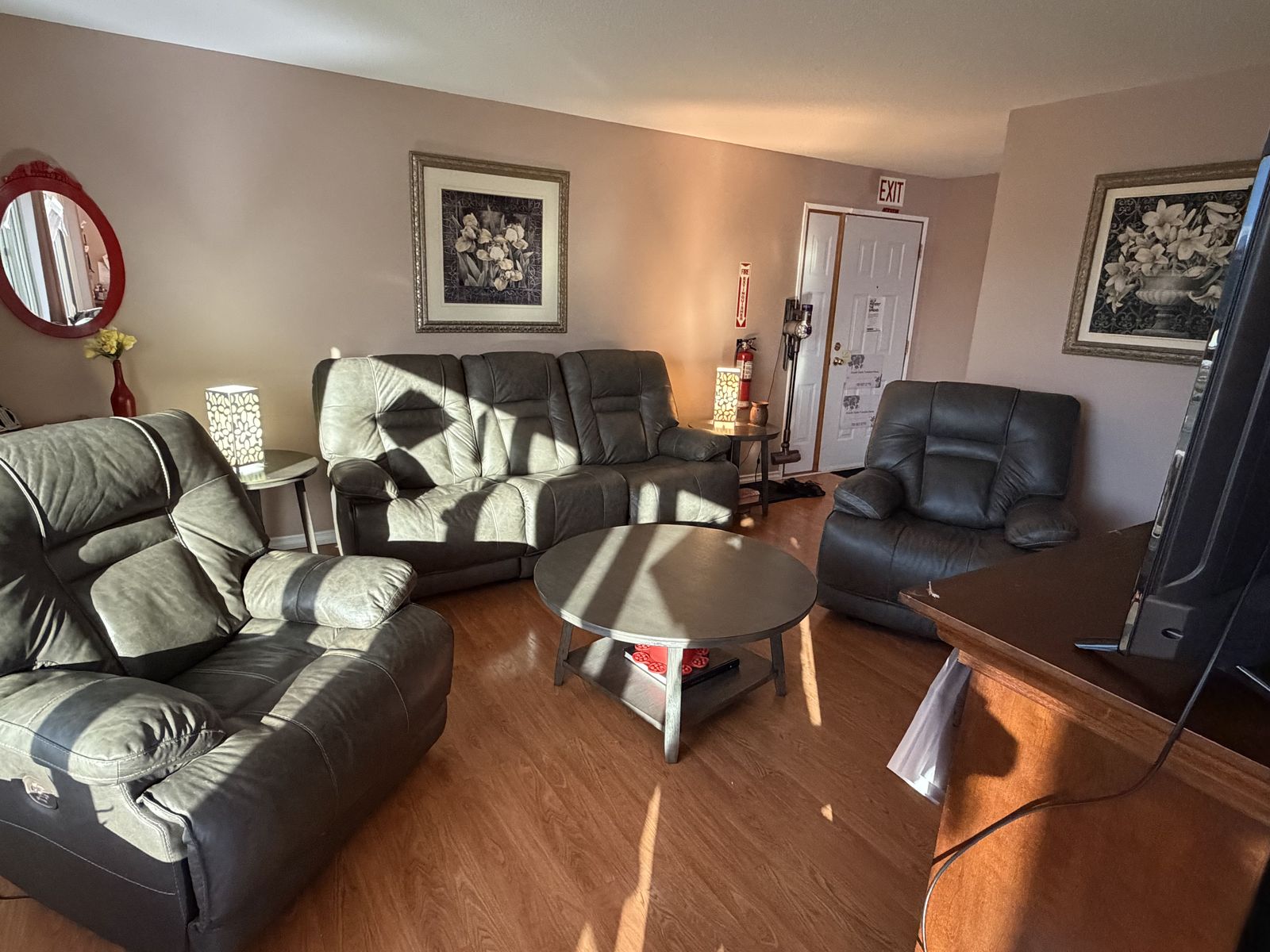 A warm, welcoming living room inside the shelter. No people shown.